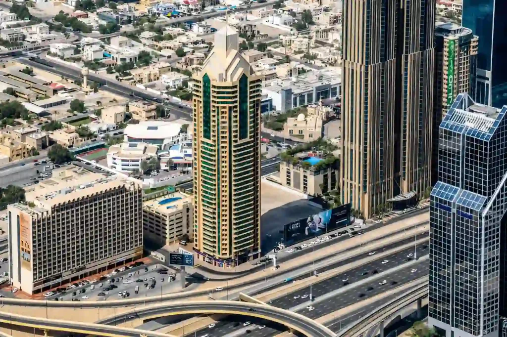 Latifa Tower Dubai skyline with Sheikh Zayed Road aerial view.